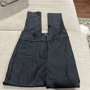 Zippered, Stretchy, with a Sheen/Shiny look